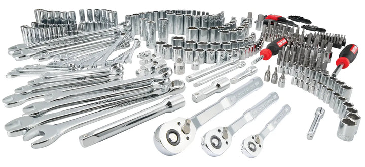 A large assortment of chrome hand tools including wrenches, ratchets, sockets, extensions, bit drivers, and screwdriver handles arranged on a white background.